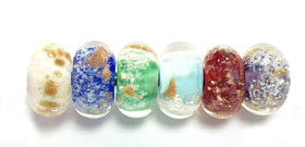 glass bead cremation jewelry with charm and cremains