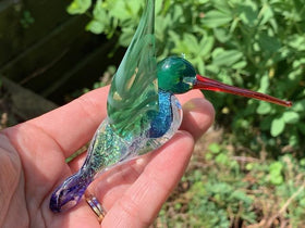 Dichroic glass hummingbird with cremation ash