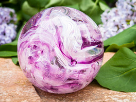 Ashes in glass orb for rememberance of people and pets