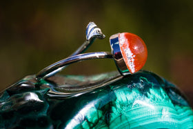 silver ring with feather and glass cabochon