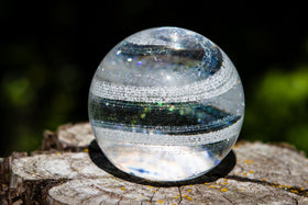 clear paperweight with cremation ash