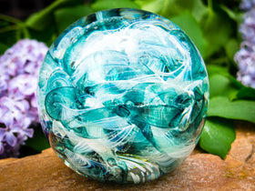 Ashes in glass orb for rememberance of people and pets