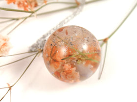 ball-pendant-with-pale-orange-babys-breath-flowers-and-infused-cremains