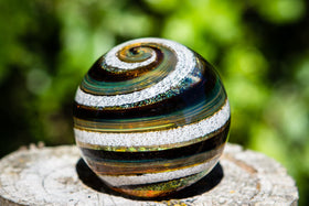 Brown amber paperweight with cremains