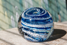 Glass paperweight with cremation ash from people and pets