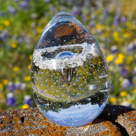 clear-bubble-veiled-memorial-egg-paperweight-with-ash-in-glass