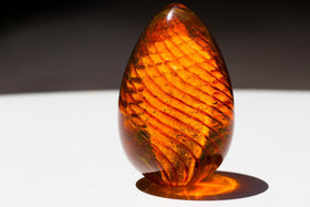 glass-spiral-cremation-urn-with-infused-ash-orange