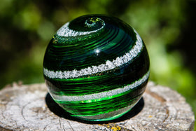 green and gold orb with cremains
