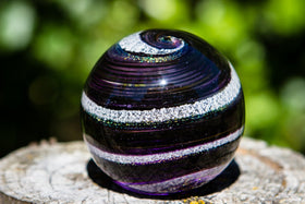 purple and gold sphere with cremation ash