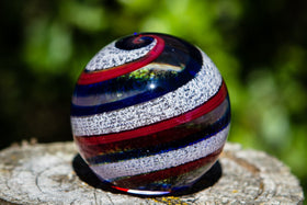 red and blue orb with cremation ash