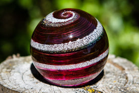 Red paperweight with cremains